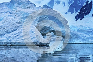 Snowing Blue Iceberg Arch Reflection Paradise Bay Skintorp Cove Antarctica