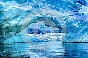Snowing Floating Blue Iceberg Arch Reflection Paradise Bay Skintorp Cove Antarctica