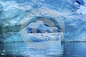 Snowing Floating Blue Iceberg Arch Reflection Paradise Bay Skintorp Cove Antarctica