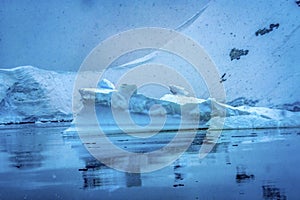 Snowing Floating Blue Iceberg Reflection Paradise Bay Skintorp Cove Antarctica