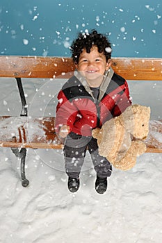 Snowing on a little boy photo