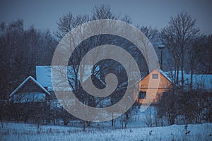 Snowing at night in a village