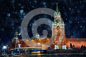 Snowing over Kremlin clocktower in Moscow, Russia photo