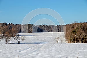 Snowlandscape in Germany with high seat for animal observation