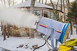 Snowmaking or cannon at the park. Snow machine produce snow for ski resort. Snow cannon during snowmaking slope