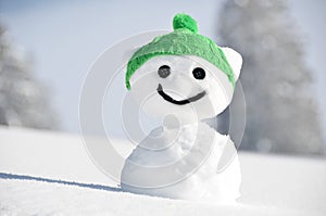 Snowman against Alpine scenery