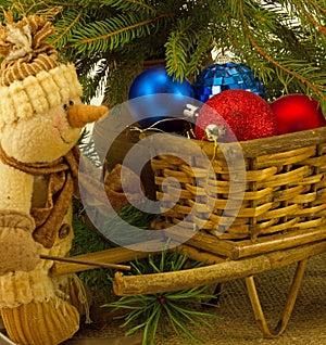 Snowman with basket of Christmas toys