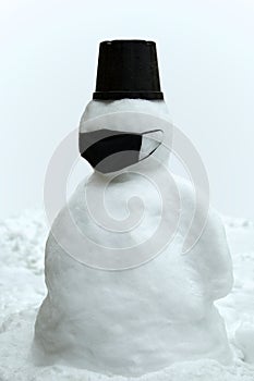 Snowman in black face mask
