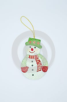 A snowman Christmas ornament for hanging on a Christmas tree, during this festive season.