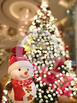 Snowman with christmas tree.