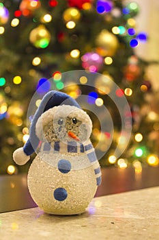 Snowman with Christmas tree background photo