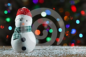 Snowman and Christmas tree. Winter home decorations. Holiday traditions and gifts. Merry Christmas. Snowman toy