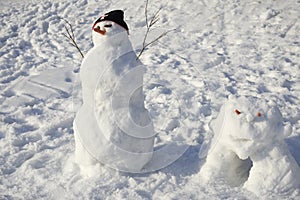 Snowman creature standing in winter landscape