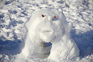 Snowman creature standing in winter landscape