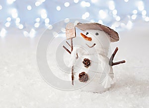 Snowman decoration on bokeh background