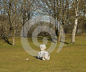 Snowman on field with no snow anymore around