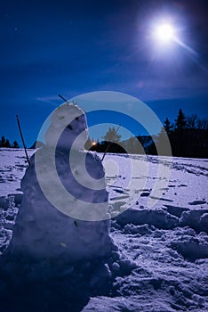 Snowman with a full moon