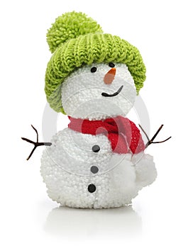 Snowman in green hat and red scarf