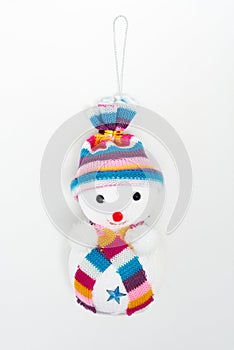 Snowman with hat and scarf on white background