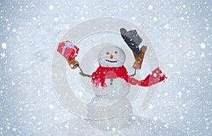 Snowman isolated on snow background. Greeting snowman. Happy snowman standing in winter Christmas landscape. Design Gift