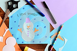 Snowman paper card with snowflakes and words I love winter. Materials for children winter crafts