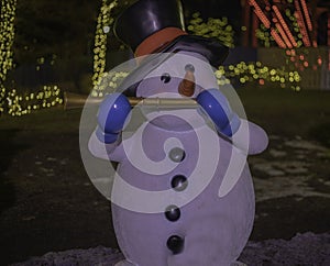 Snowman Playing The Flute At The Winter Festival