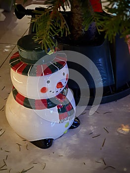 Snowman with red - green hat and scarf. Symbol of Christmas season is coming soon