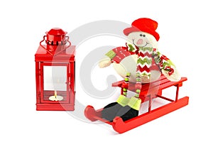 Snowman on sleigh with red lantern