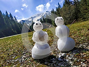 Snowman. Snowmen on the grass. With mountain background. Tatry Slovakia