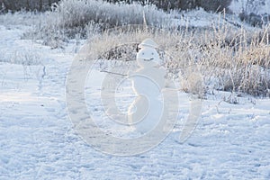 Snowman on snowy field. Black and white. Big smiling snowman  Merry Christmas and happy new year greeting card