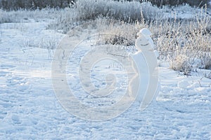 Snowman on snowy field. Black and white. Big smiling snowman  Merry Christmas and happy new year greeting card