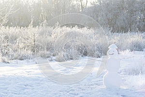 Snowman on snowy field. Black and white. Big smiling snowman  Merry Christmas and happy new year greeting card