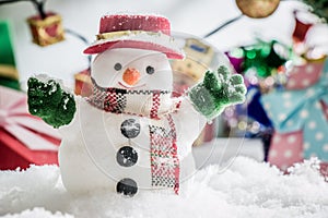 Snowman stand among pile of snow at silent night with a light bulb, light up the hopefulness and happiness in Merry christmas and