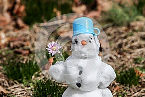 Snowman standing on grass