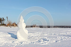 Snowman standing onfrozen river, Novosibirsk, Russia