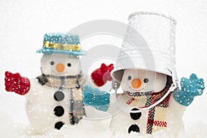 Snowman is standing in snowfall, Merry Christmas and happy New Y