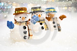 Snowman is standing in snowfall, Merry Christmas and happy New Year concept