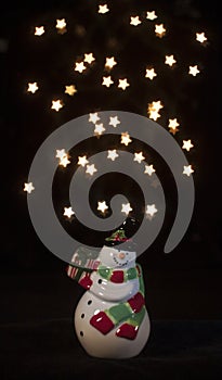 Snowman with Star Bokeh Background