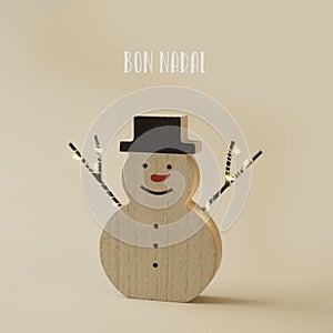 Snowman and text merry christmas in catalan photo