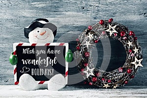 Snowman and text wish you have wonderful holidays