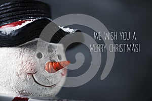 Snowman and text we wish you a merry christmas