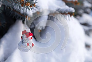 Snowman toy on a spruce