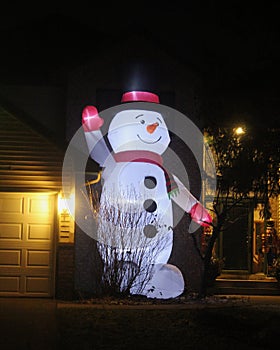 Snowman Twenty Feet Tall Illuminated at Night