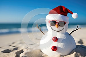 snowman wearing red santa hat and sunglasses on the beach, Happy sandy snowman with sunglasses and Santa hat on a sunny Christmas