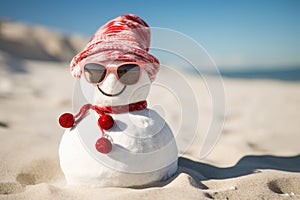 Snowman wearing sunglasses and red scarf on the beach at Christmas time, Happy sandy snowman with sunglasses and Santa hat on a