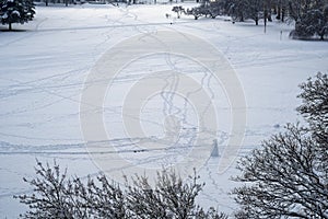 Snowmen and foot traces in winter scenery