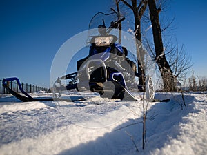 Snowmobile and blue sky