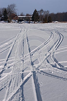Snowmobile Tracks in Snow During Winter