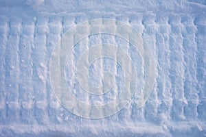 snowmobile trail on melted snow. Winter time