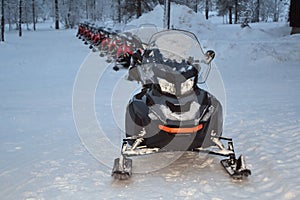 Snowmobiles lined up for an excursion